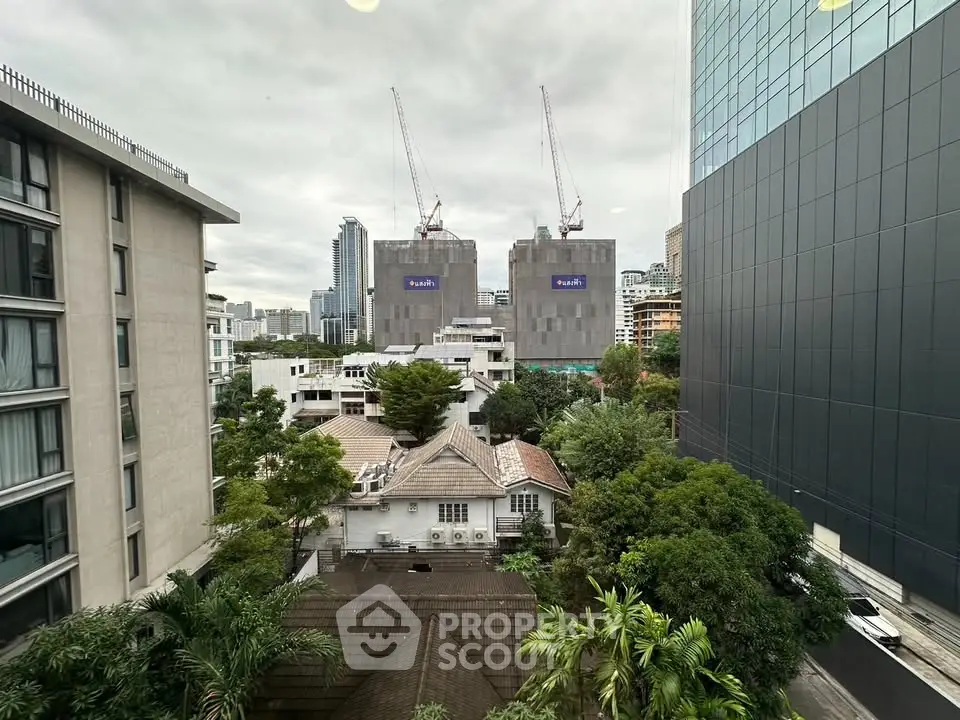 Stunning urban view with modern skyscrapers and lush greenery, perfect for city living enthusiasts.