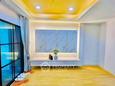Modern living room with elegant ceiling lights and stylish wall decor