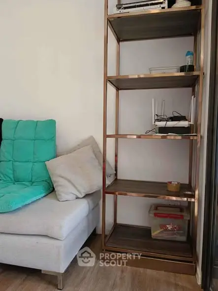 Modern living room with stylish shelving and cozy seating area