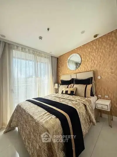 Luxurious bedroom with elegant decor and large window for natural light