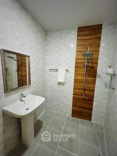 Modern bathroom with stylish shower and sleek sink design