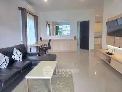 Modern living room with sleek furniture and open layout, perfect for contemporary living.