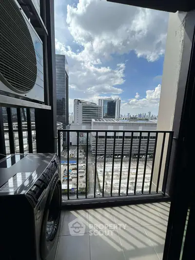 Urban balcony with washing machine and city skyline view