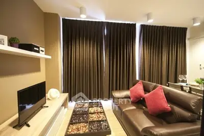 Modern living room with stylish decor and cozy seating area.