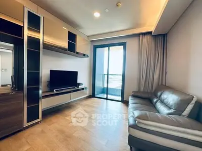 Modern living room with sleek furniture and balcony view in a stylish apartment.