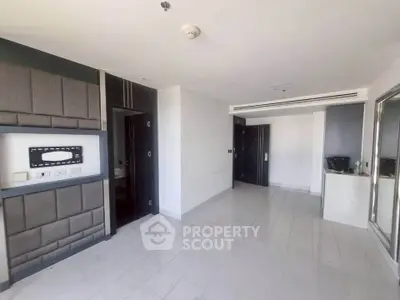 Spacious modern living room with sleek design and ample natural light