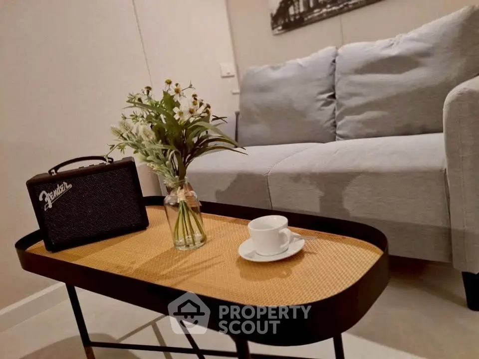 Stylish living room with cozy sofa and chic coffee table, perfect for relaxation.