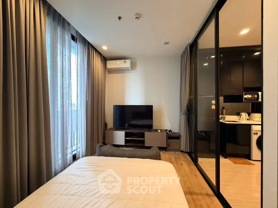 Modern bedroom with large windows and sleek interior design