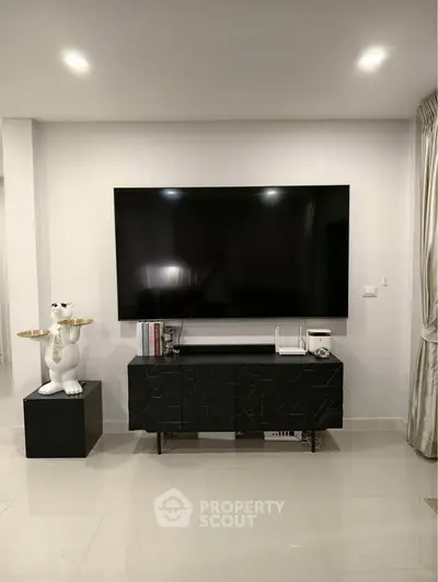 Modern living room with sleek TV setup and stylish decor