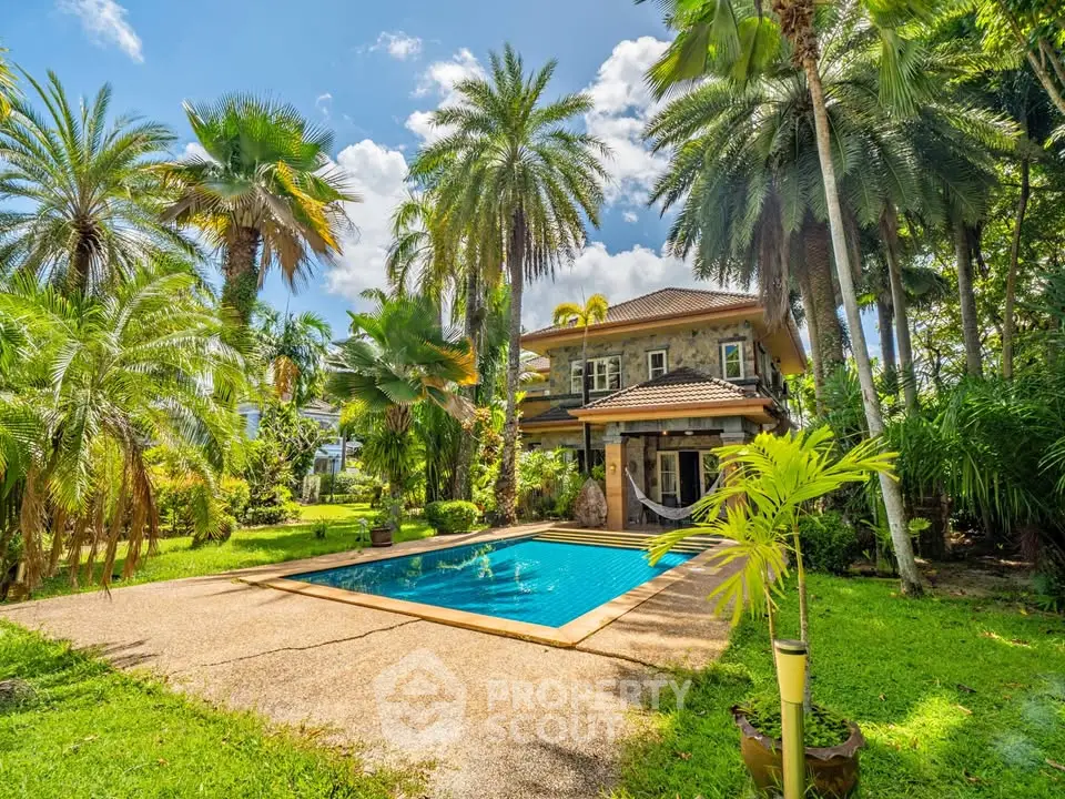 Luxurious tropical villa with private pool and lush garden, perfect for serene living.