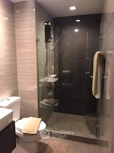 Modern bathroom with glass shower and sleek design