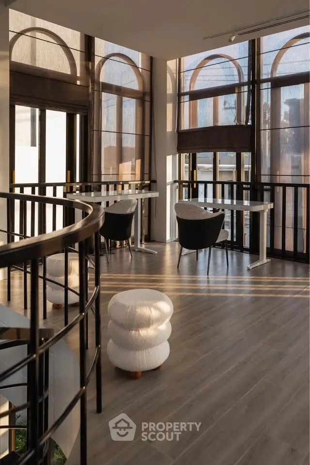Elegant modern interior with large windows and stylish furniture, perfect for a sophisticated living space.