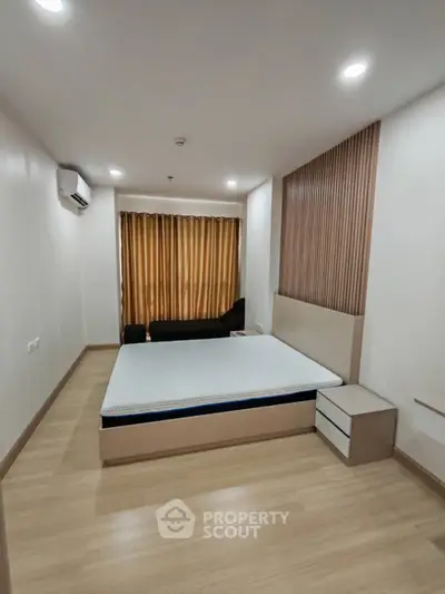 Modern bedroom with minimalist design and wooden flooring