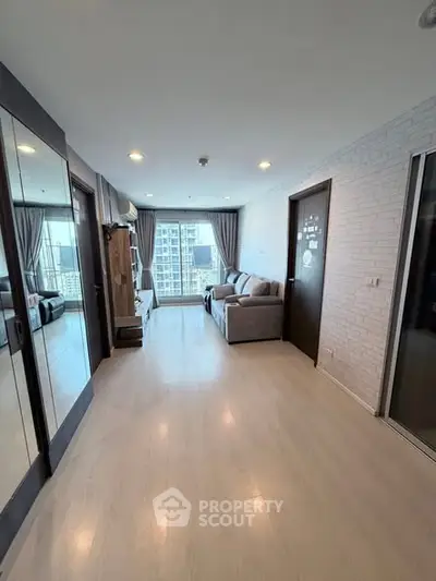 Spacious modern living room with city view and stylish decor