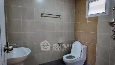 Modern bathroom with sleek fixtures and neutral tile design