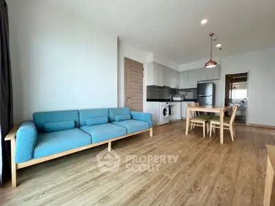 Spacious modern living room with open kitchen and stylish furniture