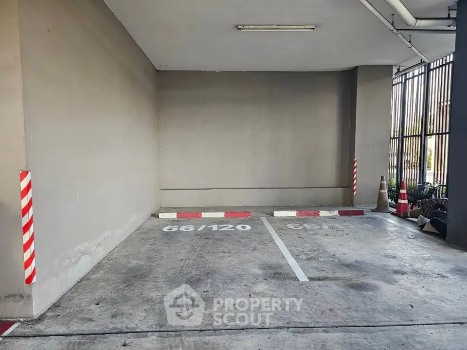 Secure parking space in modern building with designated spots and clear markings.