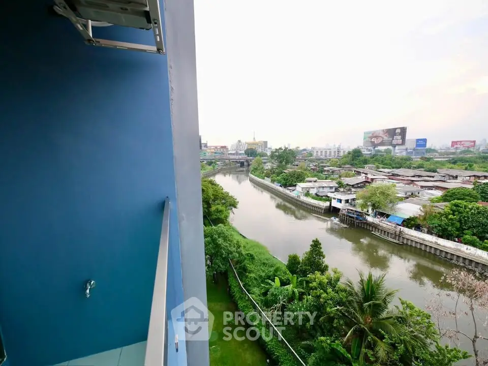 Stunning river view from a high-rise balcony, perfect for serene living.