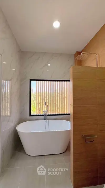 Luxurious bathroom with freestanding bathtub and modern shower design