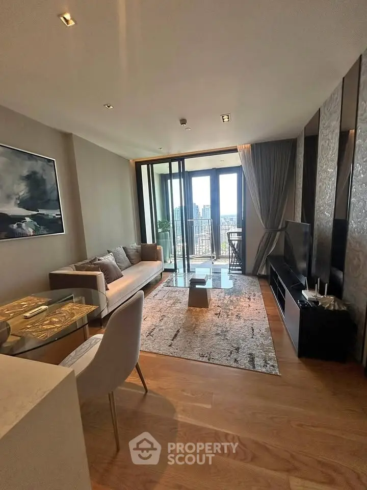 Luxurious living room with modern decor and stunning city view from balcony.