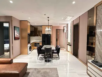 Luxurious modern living room with open kitchen, elegant dining area, and stylish decor.