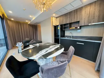 Modern open-plan living room with elegant kitchen and stylish dining area