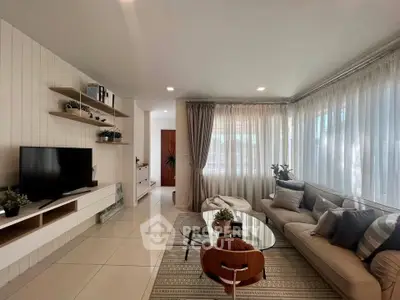 Stylish modern living room with cozy seating and natural light