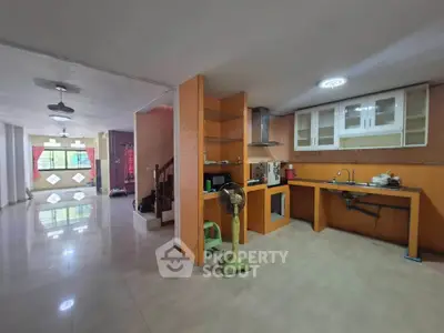 Spacious open-plan kitchen and living area with modern fixtures and ample natural light.