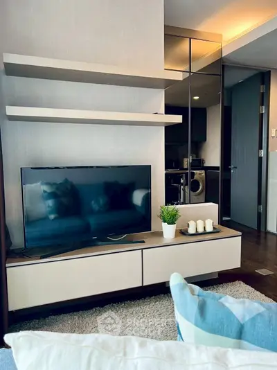 Modern living room with sleek TV unit and cozy decor