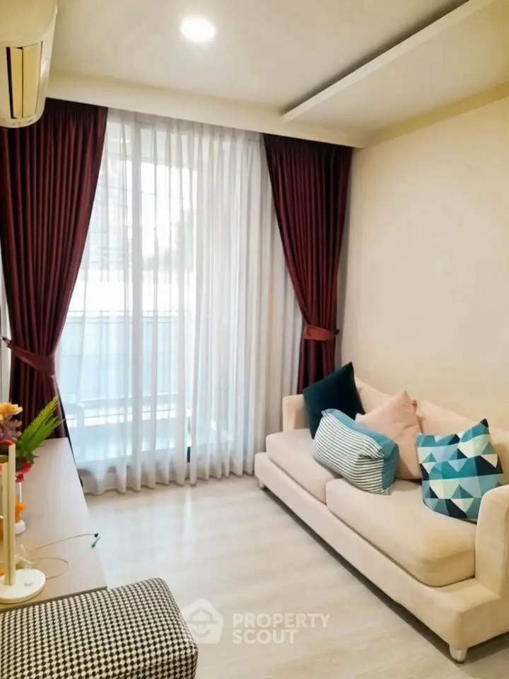 Cozy living room with elegant curtains and stylish sofa in modern apartment