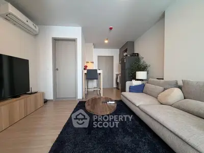 Modern living room with cozy sofa and sleek TV setup