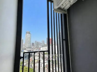 Stunning city view from a modern balcony with sleek railing design, perfect for urban living.