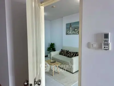 Cozy living room with modern decor and neutral tones, perfect for relaxation.