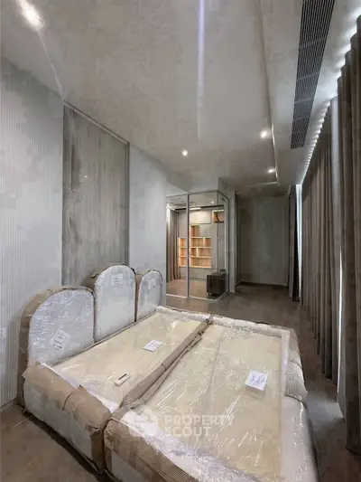 Spacious bedroom with modern design and ample natural light