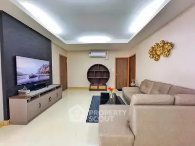 Spacious modern living room with elegant decor and comfortable seating, perfect for relaxation and entertainment.