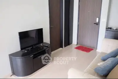 Modern living room with sleek TV stand and comfortable sofa in a stylish apartment.