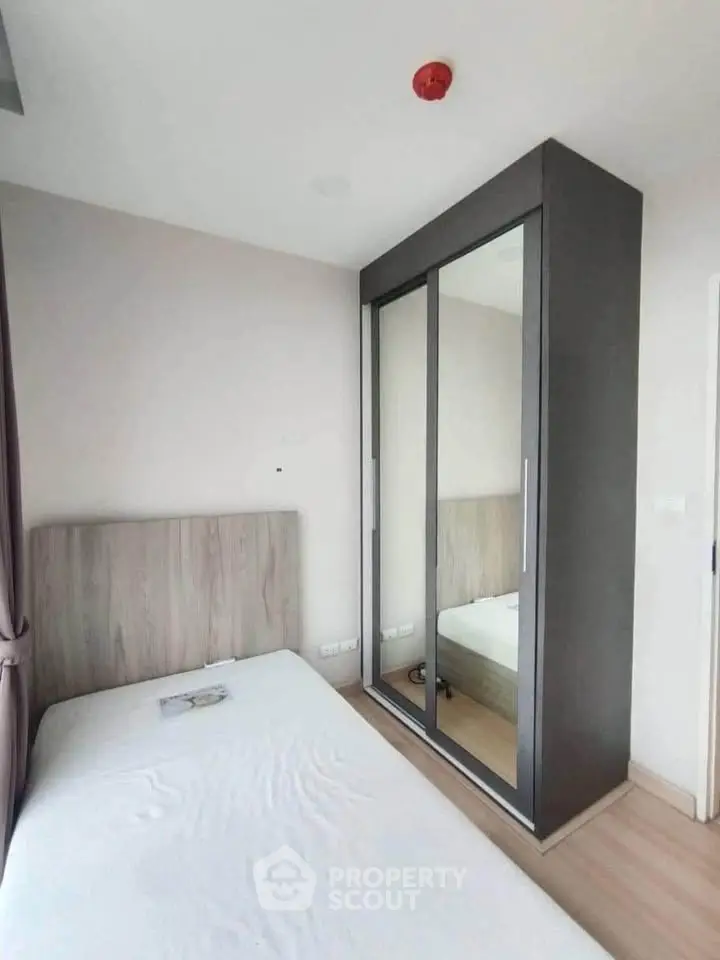 Modern bedroom with sleek wardrobe and minimalist design
