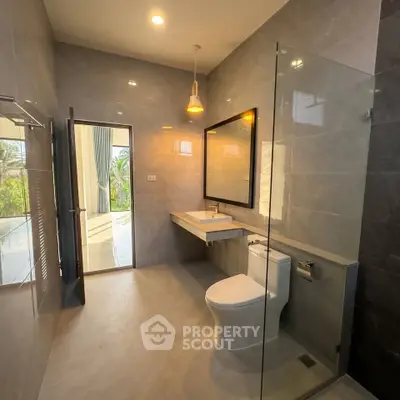 Luxurious modern bathroom with sleek design and glass shower enclosure
