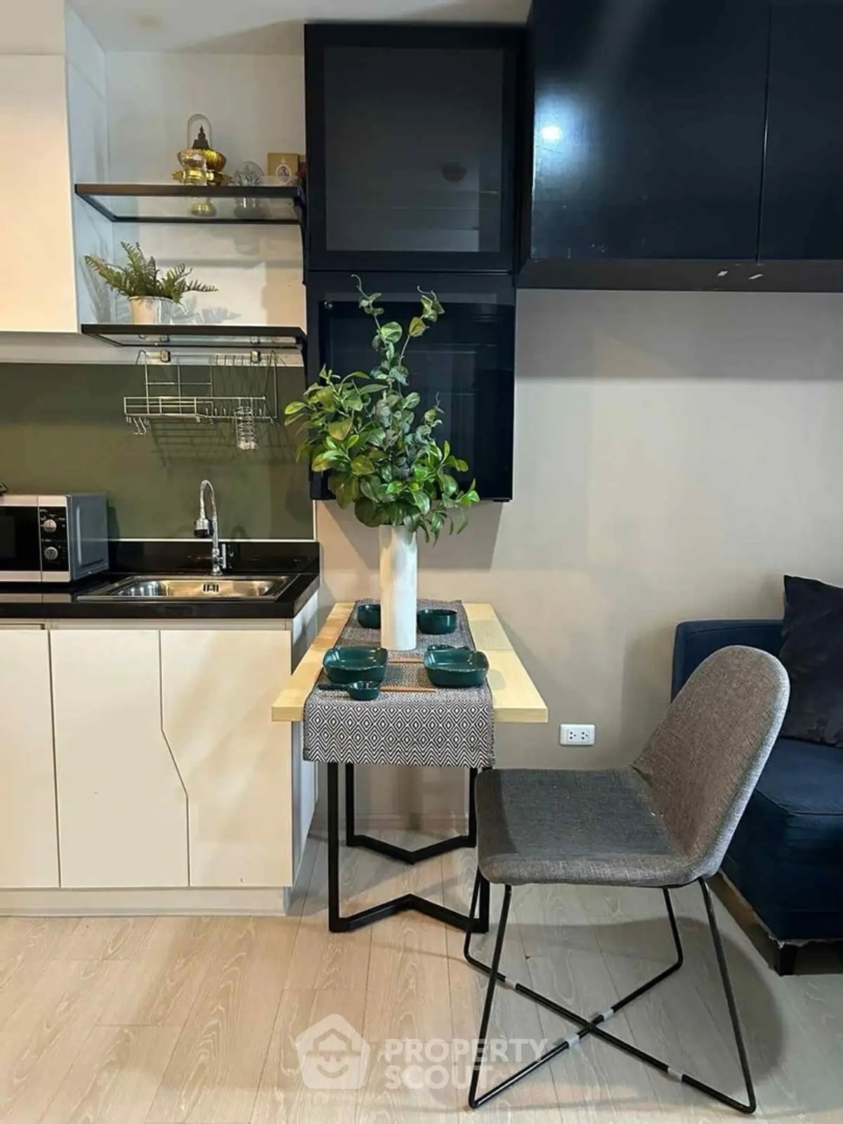 Modern compact kitchen with dining area and stylish decor