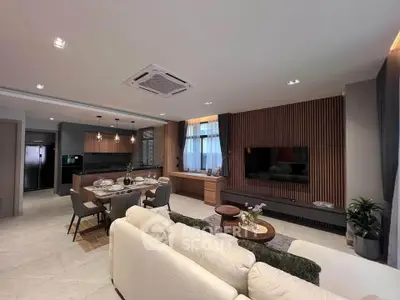 Luxurious open-plan living room with modern kitchen and elegant decor
