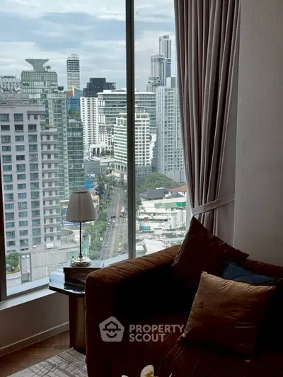 Luxurious living room with stunning city view from high-rise apartment window.