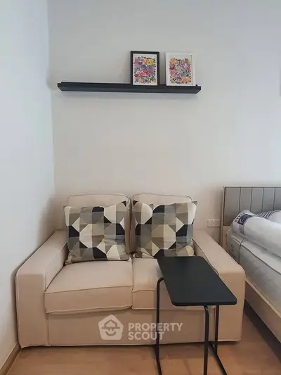 Cozy bedroom corner with stylish sofa and modern decor