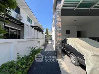 Modern house exterior with covered carport and sleek design