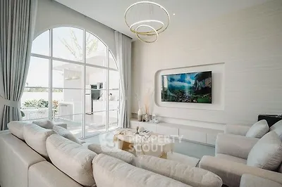 Luxurious modern living room with elegant decor and large window view