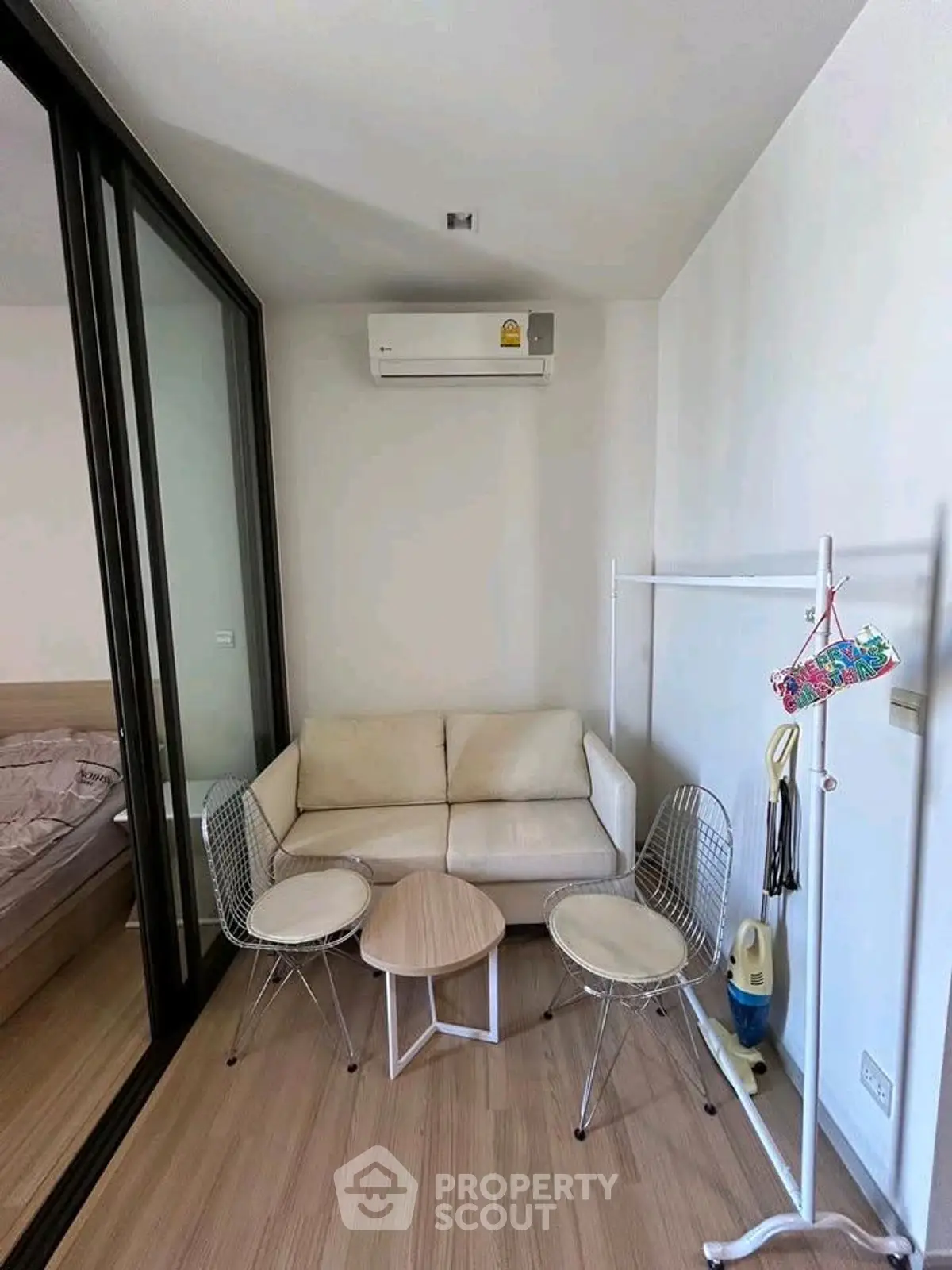 Cozy small living area with modern furniture and air conditioning