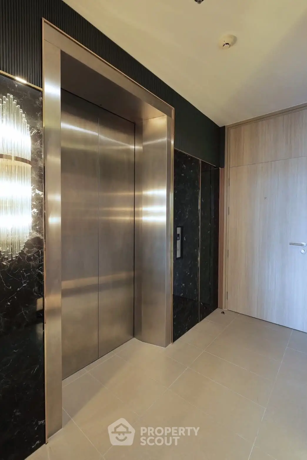 Luxurious modern elevator entrance with sleek design and ambient lighting
