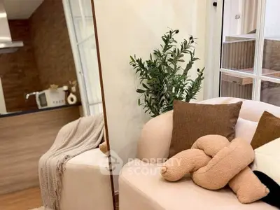 Cozy living room with modern decor and plush seating, perfect for relaxation.
