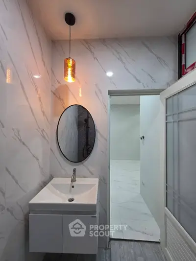 Modern bathroom with stylish lighting and sleek vanity