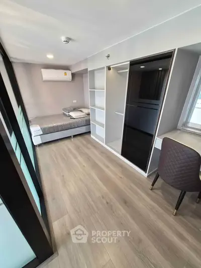 Modern studio apartment with sleek design and ample storage space