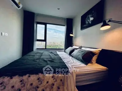 Cozy bedroom with large window offering stunning city view, modern decor, and ambient lighting.